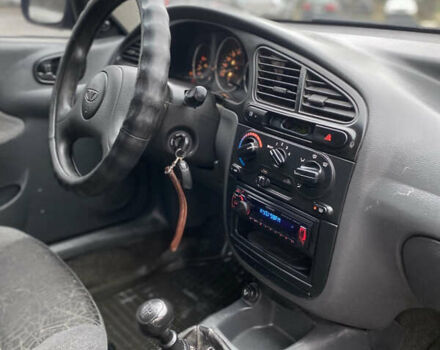 Красный Дэу Ланос, объемом двигателя 1.5 л и пробегом 350 тыс. км за 1399 $, фото 6 на Automoto.ua