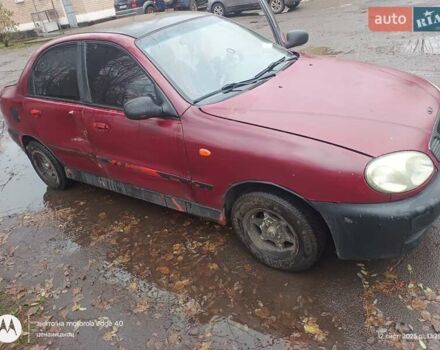 Красный Дэу Ланос, объемом двигателя 2 л и пробегом 123 тыс. км за 1185 $, фото 1 на Automoto.ua