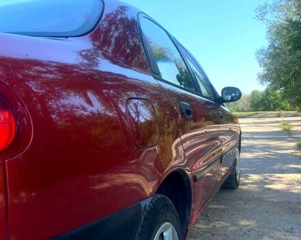 Красный Дэу Ланос, объемом двигателя 1.5 л и пробегом 93 тыс. км за 2500 $, фото 3 на Automoto.ua