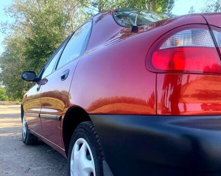 Красный Дэу Ланос, объемом двигателя 1.5 л и пробегом 93 тыс. км за 2500 $, фото 2 на Automoto.ua