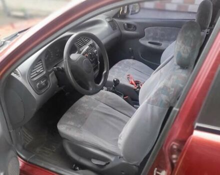 Красный Дэу Ланос, объемом двигателя 1.3 л и пробегом 270 тыс. км за 1600 $, фото 2 на Automoto.ua