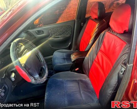 Червоний Деу Ланос, об'ємом двигуна 1.5 л та пробігом 300 тис. км за 1350 $, фото 6 на Automoto.ua