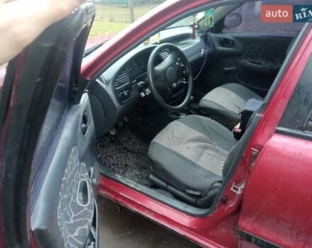 Красный Дэу Ланос, объемом двигателя 1.3 л и пробегом 226 тыс. км за 1500 $, фото 2 на Automoto.ua