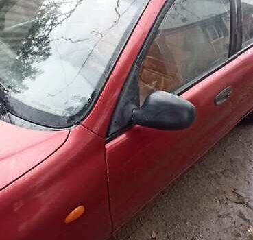 Красный Дэу Ланос, объемом двигателя 1.5 л и пробегом 150 тыс. км за 1000 $, фото 10 на Automoto.ua