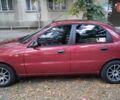 Красный Дэу Ланос, объемом двигателя 1.5 л и пробегом 275 тыс. км за 3300 $, фото 1 на Automoto.ua