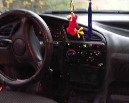 Красный Дэу Ланос, объемом двигателя 1.5 л и пробегом 174 тыс. км за 1750 $, фото 11 на Automoto.ua