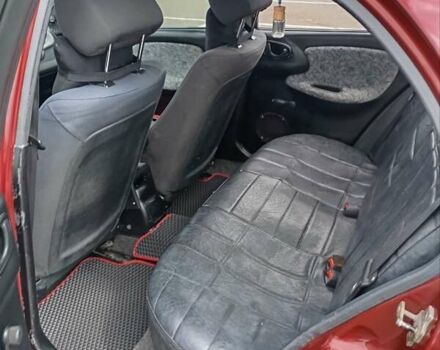 Красный Дэу Ланос, объемом двигателя 1.5 л и пробегом 390 тыс. км за 2399 $, фото 1 на Automoto.ua