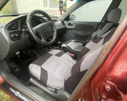 Красный Дэу Ланос, объемом двигателя 1.6 л и пробегом 297 тыс. км за 2500 $, фото 7 на Automoto.ua