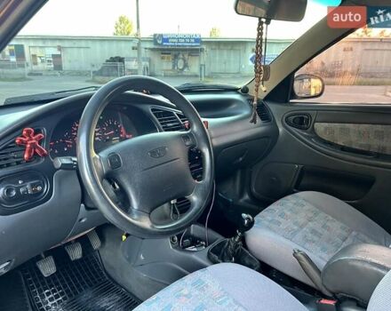 Красный Дэу Ланос, объемом двигателя 1.5 л и пробегом 150 тыс. км за 3300 $, фото 1 на Automoto.ua