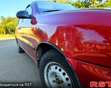 Красный Дэу Ланос, объемом двигателя 1.5 л и пробегом 165 тыс. км за 2100 $, фото 4 на Automoto.ua