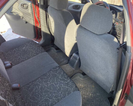 Красный Дэу Ланос, объемом двигателя 1.5 л и пробегом 230 тыс. км за 2100 $, фото 7 на Automoto.ua