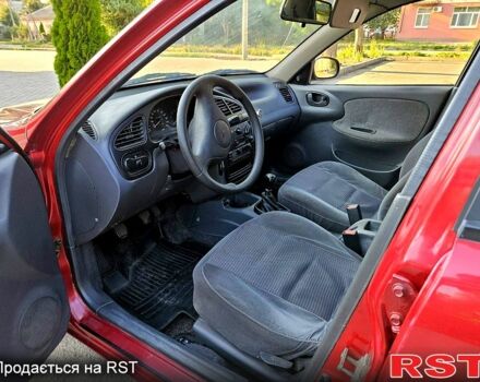 Красный Дэу Ланос, объемом двигателя 1.5 л и пробегом 165 тыс. км за 2100 $, фото 6 на Automoto.ua