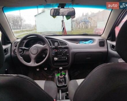 Красный Дэу Ланос, объемом двигателя 1.5 л и пробегом 245 тыс. км за 1100 $, фото 4 на Automoto.ua