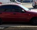 Красный Дэу Ланос, объемом двигателя 1.6 л и пробегом 275 тыс. км за 2390 $, фото 1 на Automoto.ua
