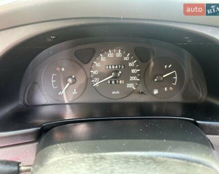 Красный Дэу Ланос, объемом двигателя 1.5 л и пробегом 59 тыс. км за 3750 $, фото 4 на Automoto.ua