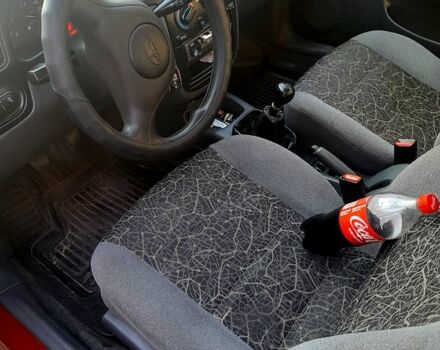 Красный Дэу Ланос, объемом двигателя 1.5 л и пробегом 200 тыс. км за 2500 $, фото 3 на Automoto.ua