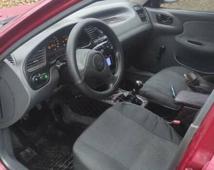 Красный Дэу Ланос, объемом двигателя 1.5 л и пробегом 260 тыс. км за 2500 $, фото 7 на Automoto.ua