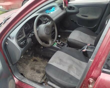 Красный Дэу Ланос, объемом двигателя 1.5 л и пробегом 245 тыс. км за 1100 $, фото 6 на Automoto.ua