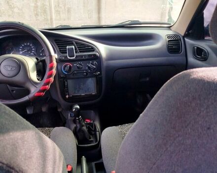 Красный Дэу Ланос, объемом двигателя 1.4 л и пробегом 180 тыс. км за 2400 $, фото 4 на Automoto.ua