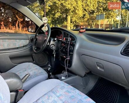 Красный Дэу Ланос, объемом двигателя 1.5 л и пробегом 150 тыс. км за 3300 $, фото 4 на Automoto.ua