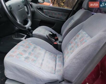 Красный Дэу Ланос, объемом двигателя 1.6 л и пробегом 244 тыс. км за 2850 $, фото 14 на Automoto.ua