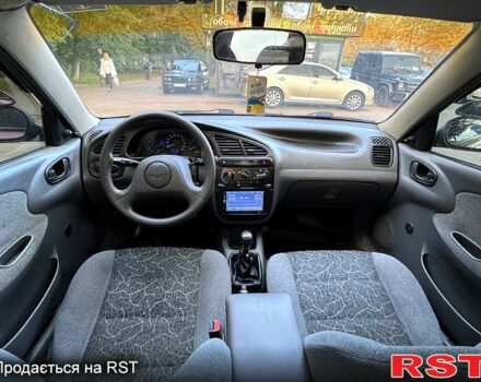 Красный Дэу Ланос, объемом двигателя 1.5 л и пробегом 290 тыс. км за 1950 $, фото 4 на Automoto.ua