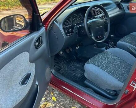 Красный Дэу Ланос, объемом двигателя 1.6 л и пробегом 216 тыс. км за 1900 $, фото 13 на Automoto.ua