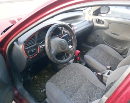 Красный Дэу Ланос, объемом двигателя 1.5 л и пробегом 175 тыс. км за 1000 $, фото 5 на Automoto.ua