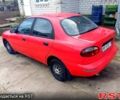 Красный Дэу Ланос, объемом двигателя 1.5 л и пробегом 350 тыс. км за 2000 $, фото 1 на Automoto.ua