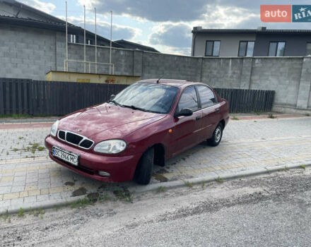 Красный Дэу Ланос, объемом двигателя 1.5 л и пробегом 250 тыс. км за 1150 $, фото 1 на Automoto.ua