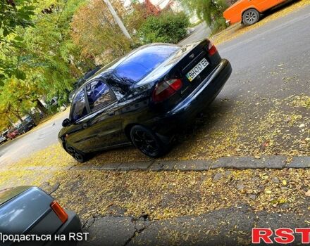 Красный Дэу Ланос, объемом двигателя 1.5 л и пробегом 116 тыс. км за 3500 $, фото 6 на Automoto.ua