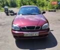 Красный Дэу Ланос, объемом двигателя 1.5 л и пробегом 255 тыс. км за 2200 $, фото 1 на Automoto.ua