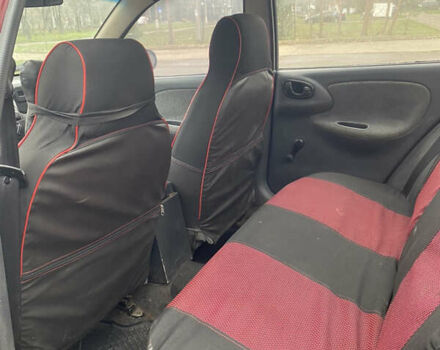 Красный Дэу Ланос, объемом двигателя 1.5 л и пробегом 250 тыс. км за 1450 $, фото 5 на Automoto.ua