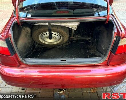 Красный Дэу Ланос, объемом двигателя 1.5 л и пробегом 290 тыс. км за 1950 $, фото 12 на Automoto.ua