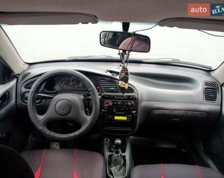 Красный Дэу Ланос, объемом двигателя 1.5 л и пробегом 322 тыс. км за 2300 $, фото 6 на Automoto.ua