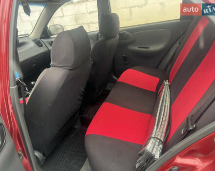 Красный Дэу Ланос, объемом двигателя 1.5 л и пробегом 183 тыс. км за 3000 $, фото 5 на Automoto.ua