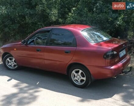 Красный Дэу Ланос, объемом двигателя 1.6 л и пробегом 304 тыс. км за 2900 $, фото 1 на Automoto.ua