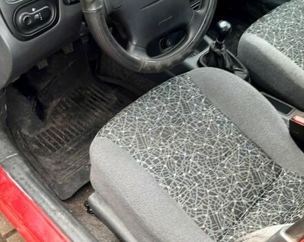 Красный Дэу Ланос, объемом двигателя 1.5 л и пробегом 151 тыс. км за 1499 $, фото 10 на Automoto.ua