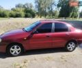 Красный Дэу Ланос, объемом двигателя 1.5 л и пробегом 322 тыс. км за 2200 $, фото 1 на Automoto.ua