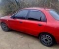 Красный Дэу Ланос, объемом двигателя 1.5 л и пробегом 325 тыс. км за 2200 $, фото 1 на Automoto.ua