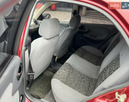 Красный Дэу Ланос, объемом двигателя 1.5 л и пробегом 250 тыс. км за 1950 $, фото 13 на Automoto.ua