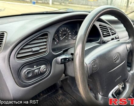 Красный Дэу Ланос, объемом двигателя 1.5 л и пробегом 220 тыс. км за 2350 $, фото 10 на Automoto.ua