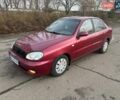Красный Дэу Ланос, объемом двигателя 1.6 л и пробегом 240 тыс. км за 1950 $, фото 1 на Automoto.ua