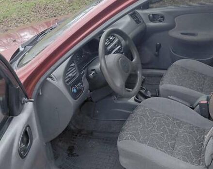 Красный Дэу Ланос, объемом двигателя 1.5 л и пробегом 230 тыс. км за 2600 $, фото 11 на Automoto.ua