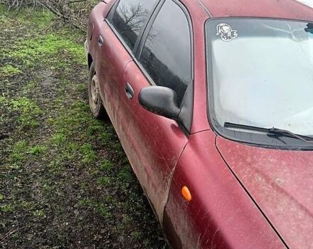 Красный Дэу Ланос, объемом двигателя 1.5 л и пробегом 100 тыс. км за 1180 $, фото 3 на Automoto.ua