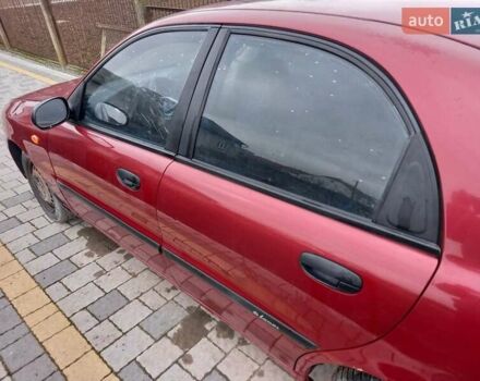 Красный Дэу Ланос, объемом двигателя 1.5 л и пробегом 153 тыс. км за 1300 $, фото 5 на Automoto.ua