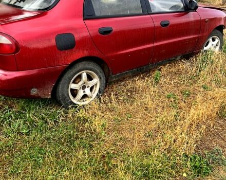 Красный Дэу Ланос, объемом двигателя 1.5 л и пробегом 200 тыс. км за 900 $, фото 1 на Automoto.ua