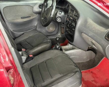 Красный Дэу Ланос, объемом двигателя 1.5 л и пробегом 305 тыс. км за 2440 $, фото 11 на Automoto.ua