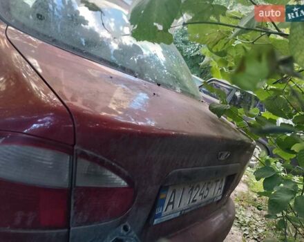 Красный Дэу Ланос, объемом двигателя 1.5 л и пробегом 250 тыс. км за 700 $, фото 2 на Automoto.ua