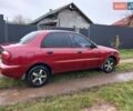 Красный Дэу Ланос, объемом двигателя 1.5 л и пробегом 289 тыс. км за 1700 $, фото 1 на Automoto.ua